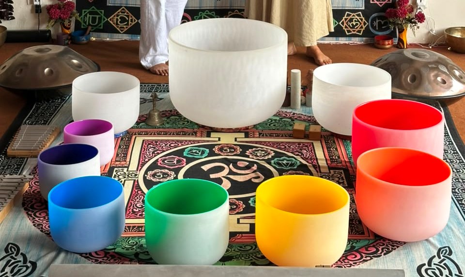 Frosted crystal singing bowls in rainbow resonance colors