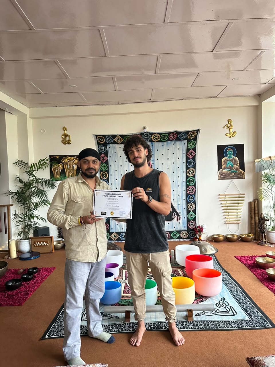 Sound healing course graduate receiving certificate