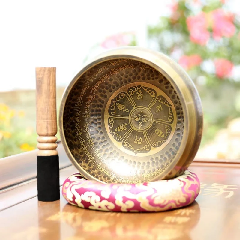 7 metal singing bowl engraved with traditional symbols